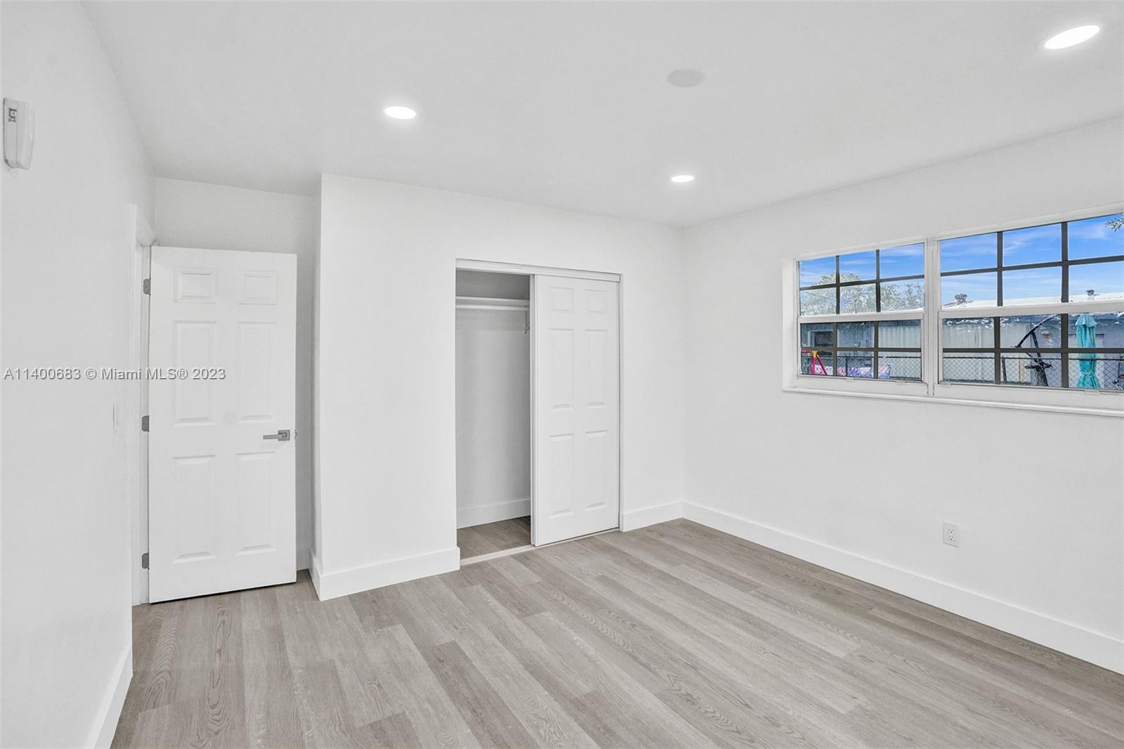 7813 Granada Boulevard Miramar, FL 33023 - Photo 14 of 35 a view of empty room with wooden floor and fan