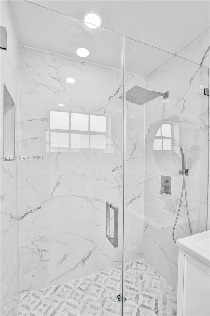 7813 Granada Boulevard Miramar, FL 33023 - Photo 16 of 35 a bathroom with a shower