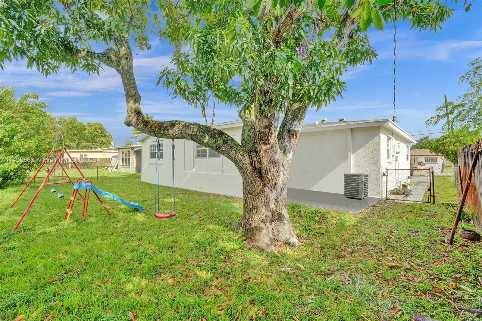 7813 Granada Boulevard Miramar, FL 33023 - Photo 31 of 35 a view of a backyard with a tree