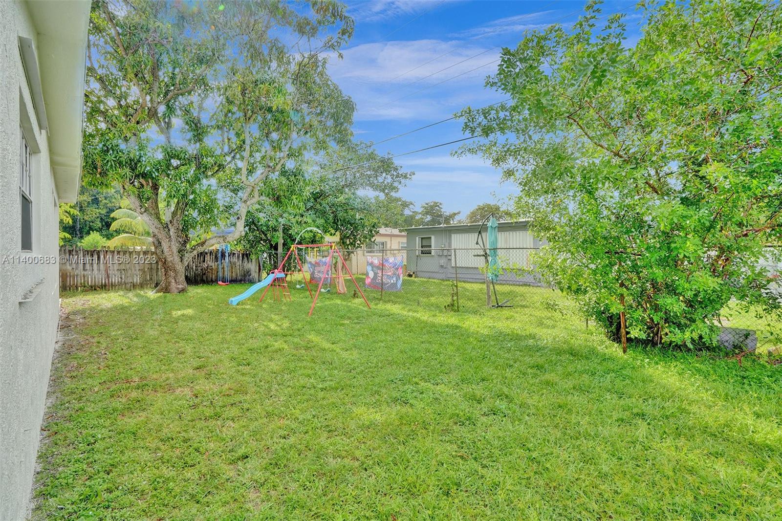 7813 Granada Boulevard Miramar, FL 33023 - Photo 33 of 35 a view of a backyard with a garden