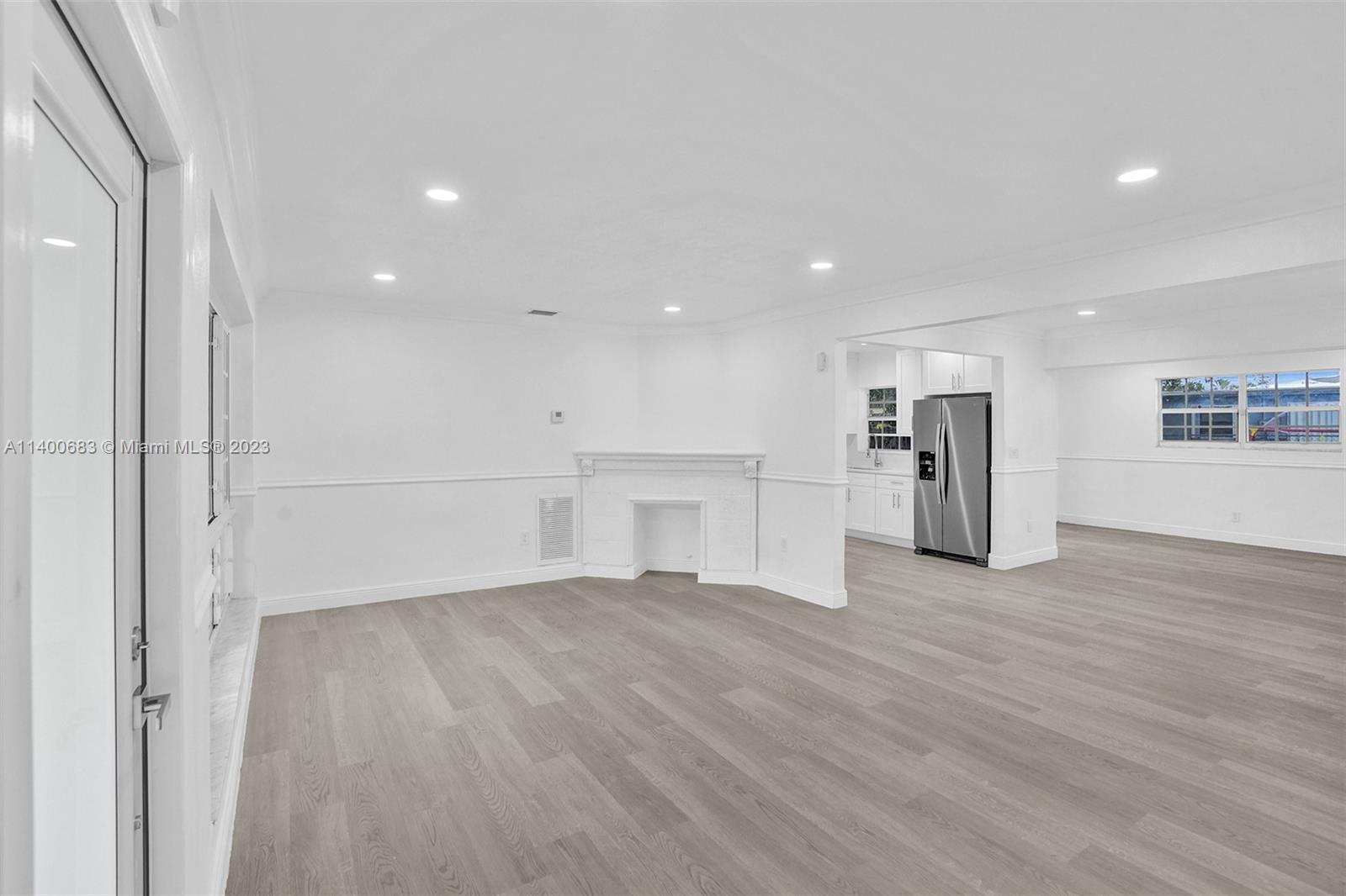 7813 Granada Boulevard Miramar, FL 33023 - Photo 6 of 35 a view of a kitchen with a sink and a refrigerator