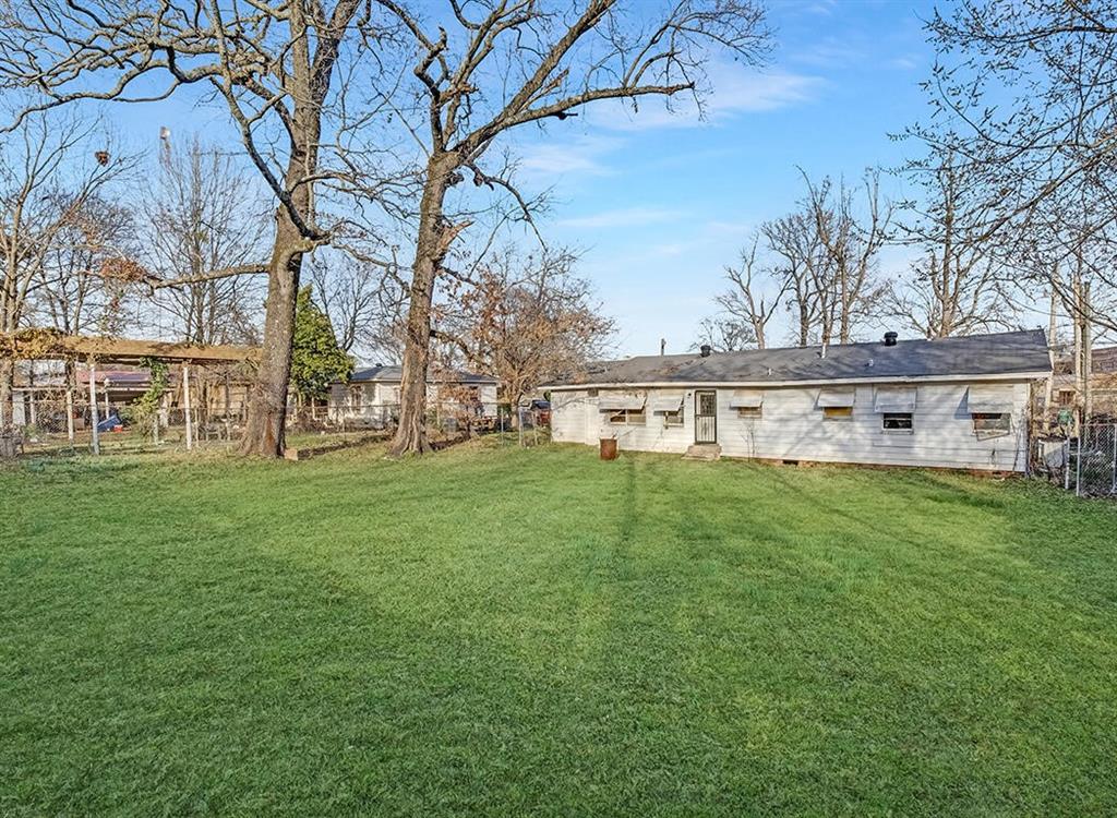 1121 Wheeler Street Texarkana, TX 75503 - Photo 5 of 14 a view of a house with a big yard