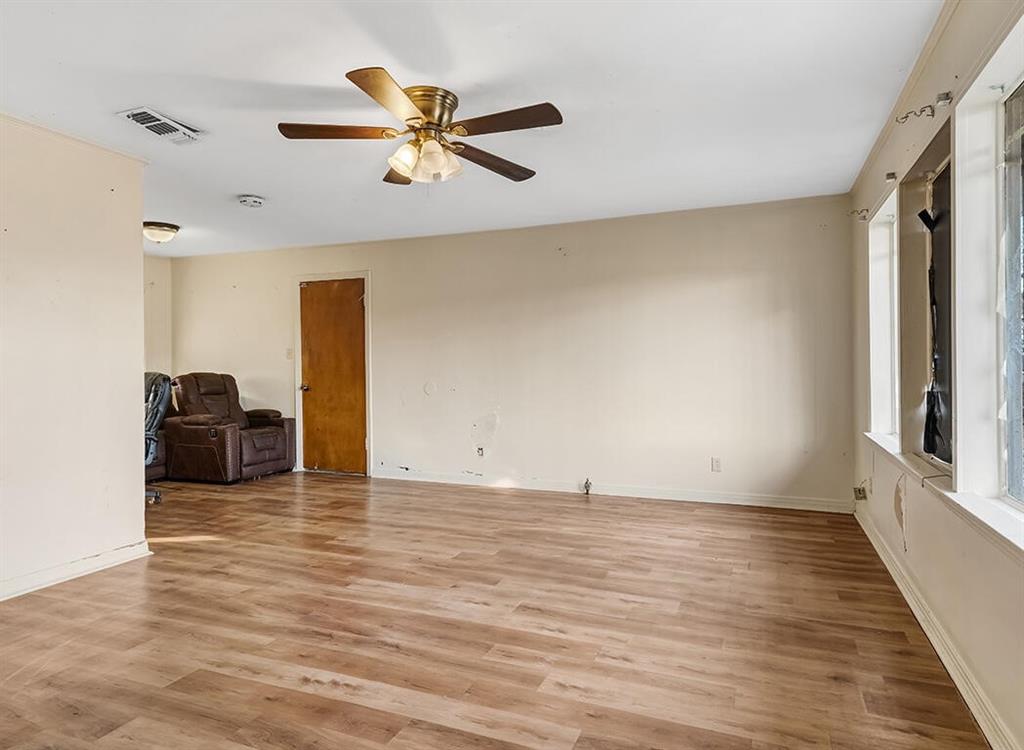 1121 Wheeler Street Texarkana, TX 75503 - Photo 7 of 14 a view of a livingroom with a ceiling fan hardwood floor and a ceiling fan