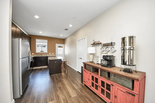 a kitchen with stainless steel appliances a refrigerator and a stove