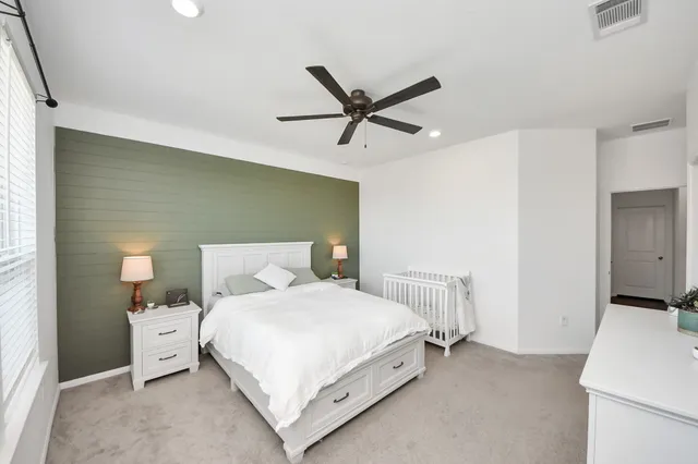 a bedroom with a bed and a cabinets