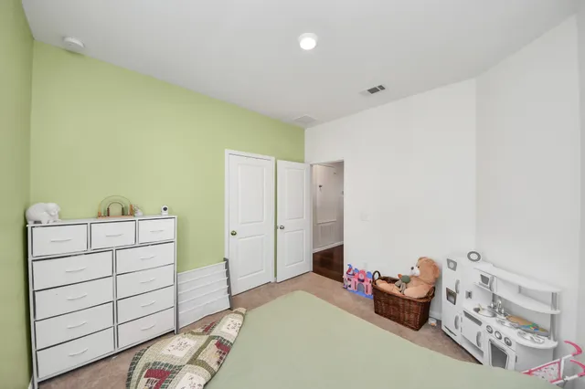 a bedroom with a bed and furniture