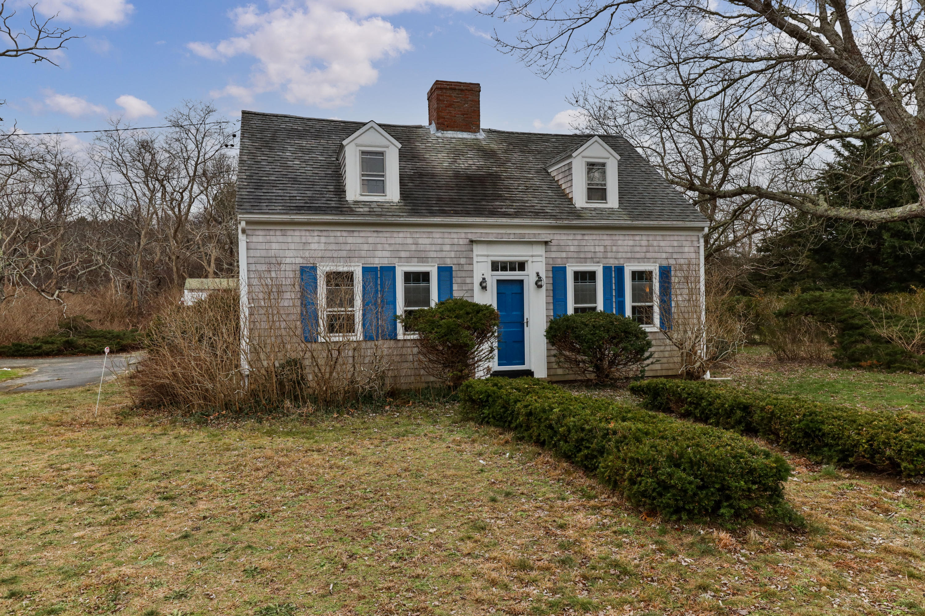 3 Hughes Road Truro, MA 02666 - Photo 1 of 34 a front view of a house with a garden
