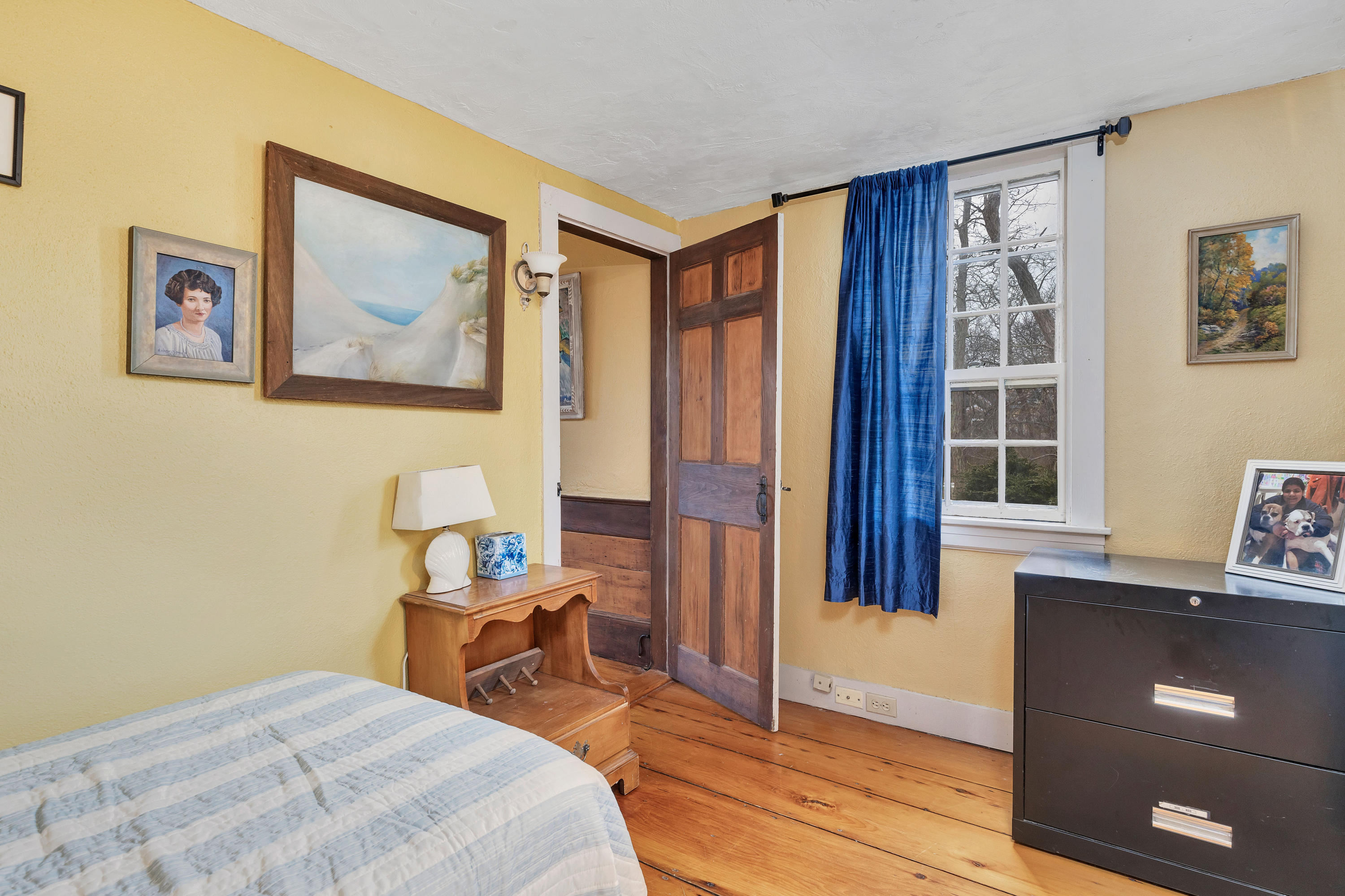 3 Hughes Road Truro, MA 02666 - Photo 13 of 34 a bedroom with a bed and wooden floor