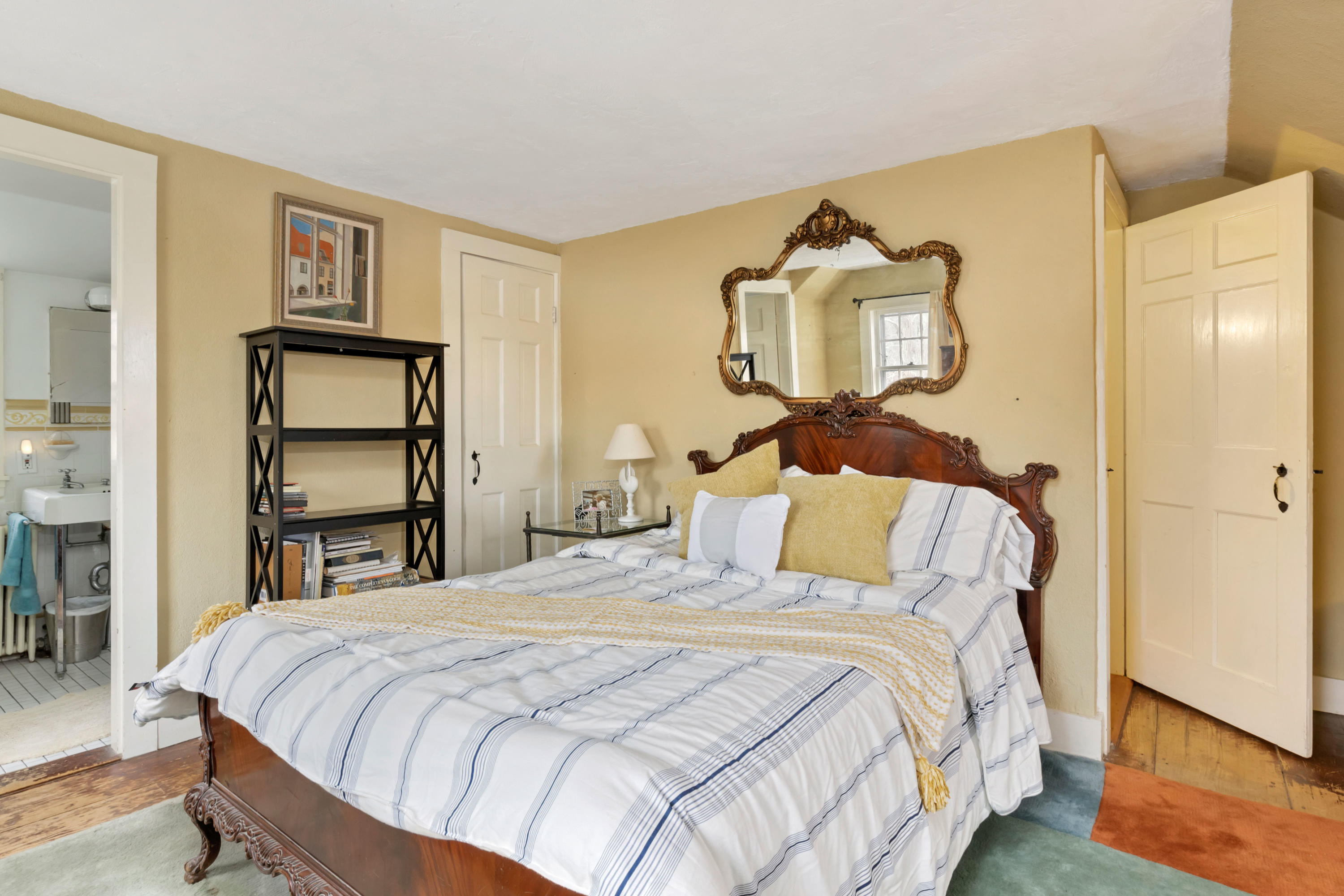 3 Hughes Road Truro, MA 02666 - Photo 17 of 34 a bedroom with a bed and a mirror