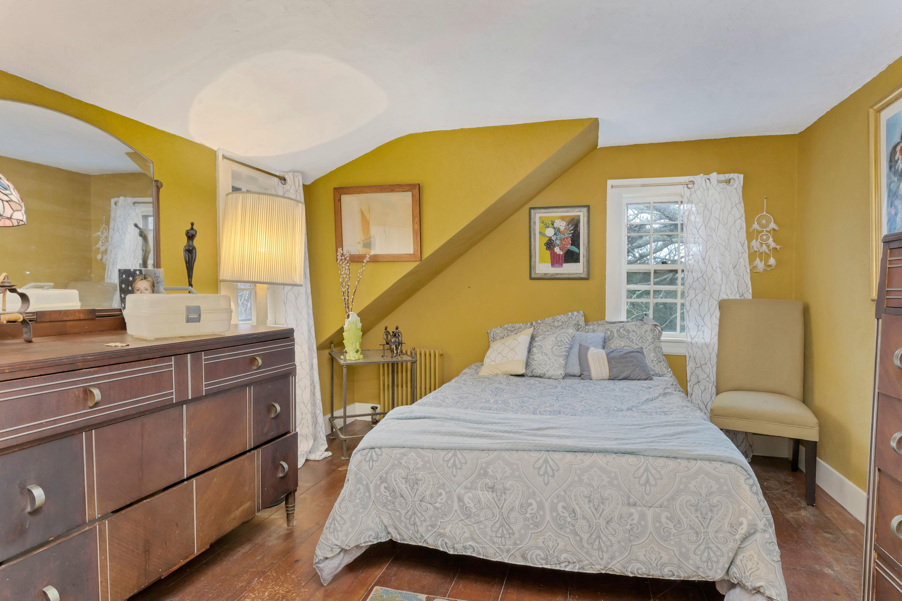 3 Hughes Road Truro, MA 02666 - Photo 20 of 34 a bedroom with a bed and wooden floor