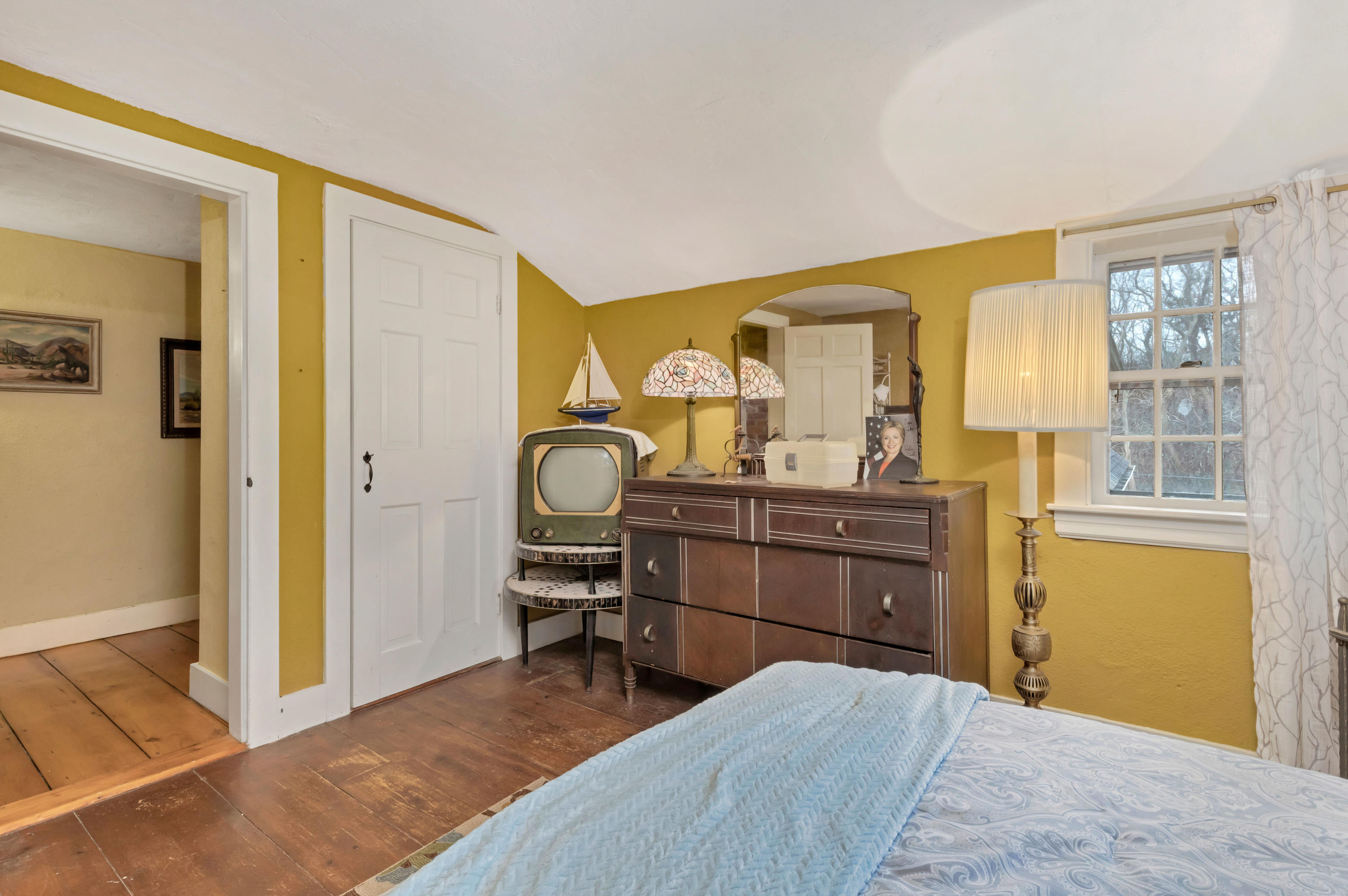 3 Hughes Road Truro, MA 02666 - Photo 21 of 34 a bedroom with a bed and wooden floor