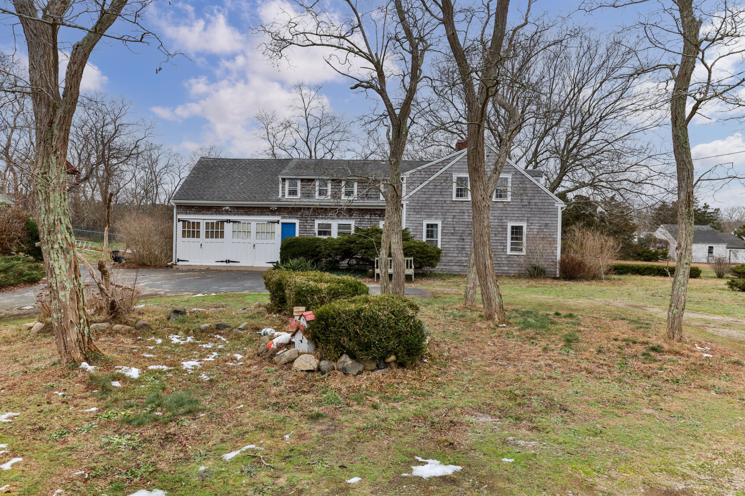 3 Hughes Road Truro, MA 02666 - Photo 29 of 34 a front view of a house with a yard and garage