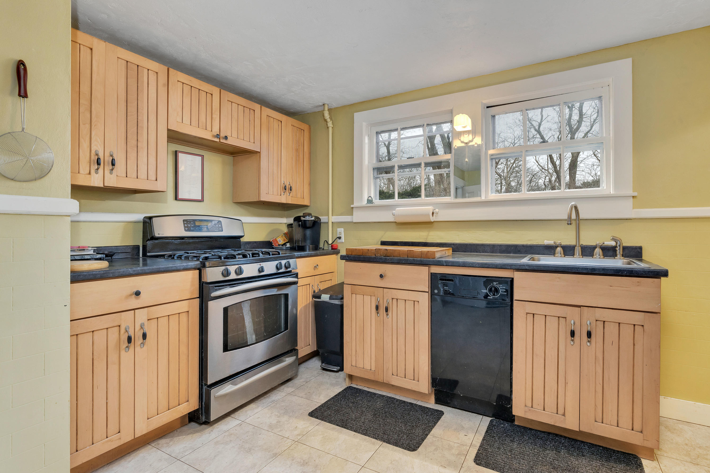 3 Hughes Road Truro, MA 02666 - Photo 4 of 34 a kitchen with stainless steel appliances granite countertop a stove and a sink