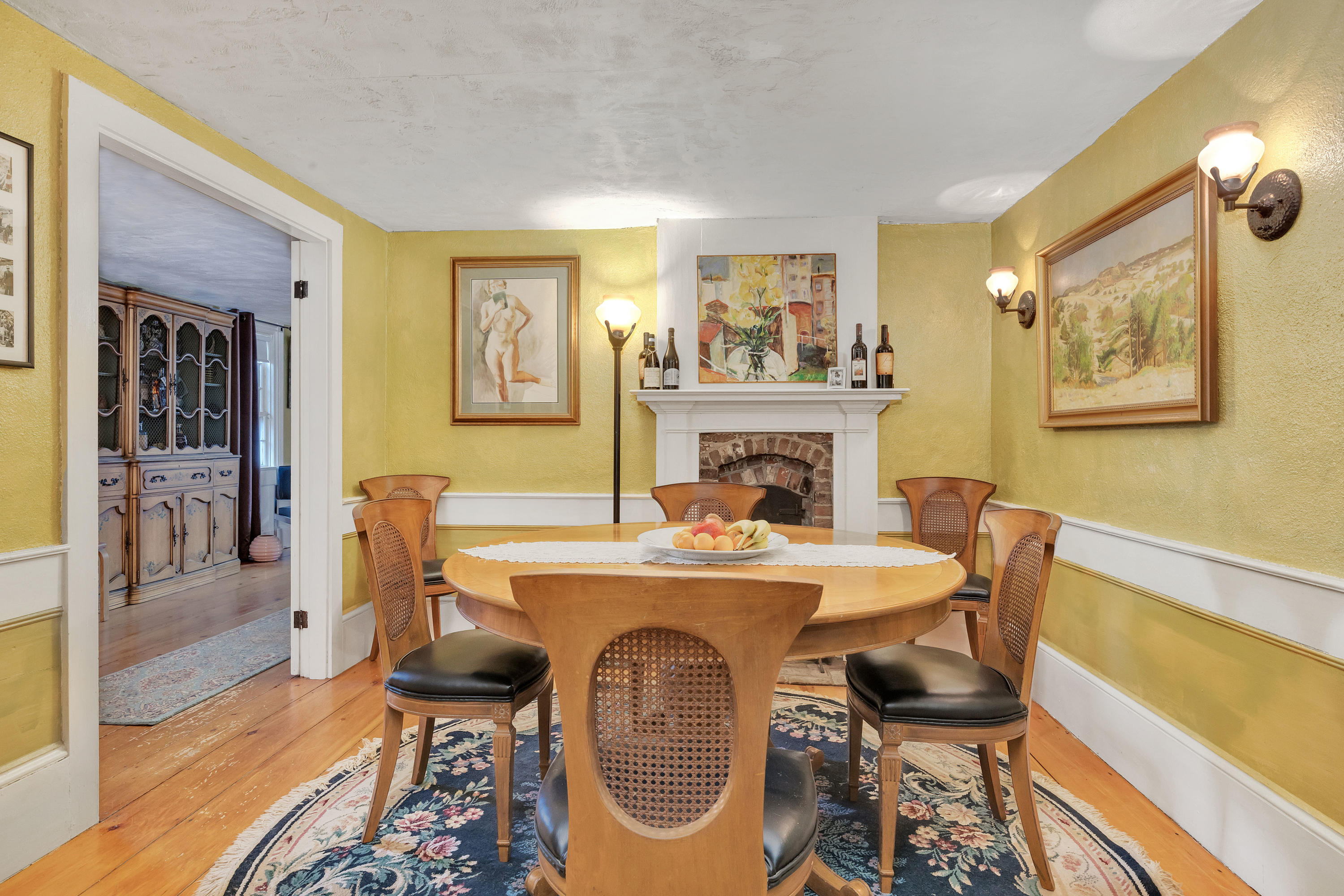 3 Hughes Road Truro, MA 02666 - Photo 6 of 34 a view of a dining room with furniture a fireplace and wooden floor