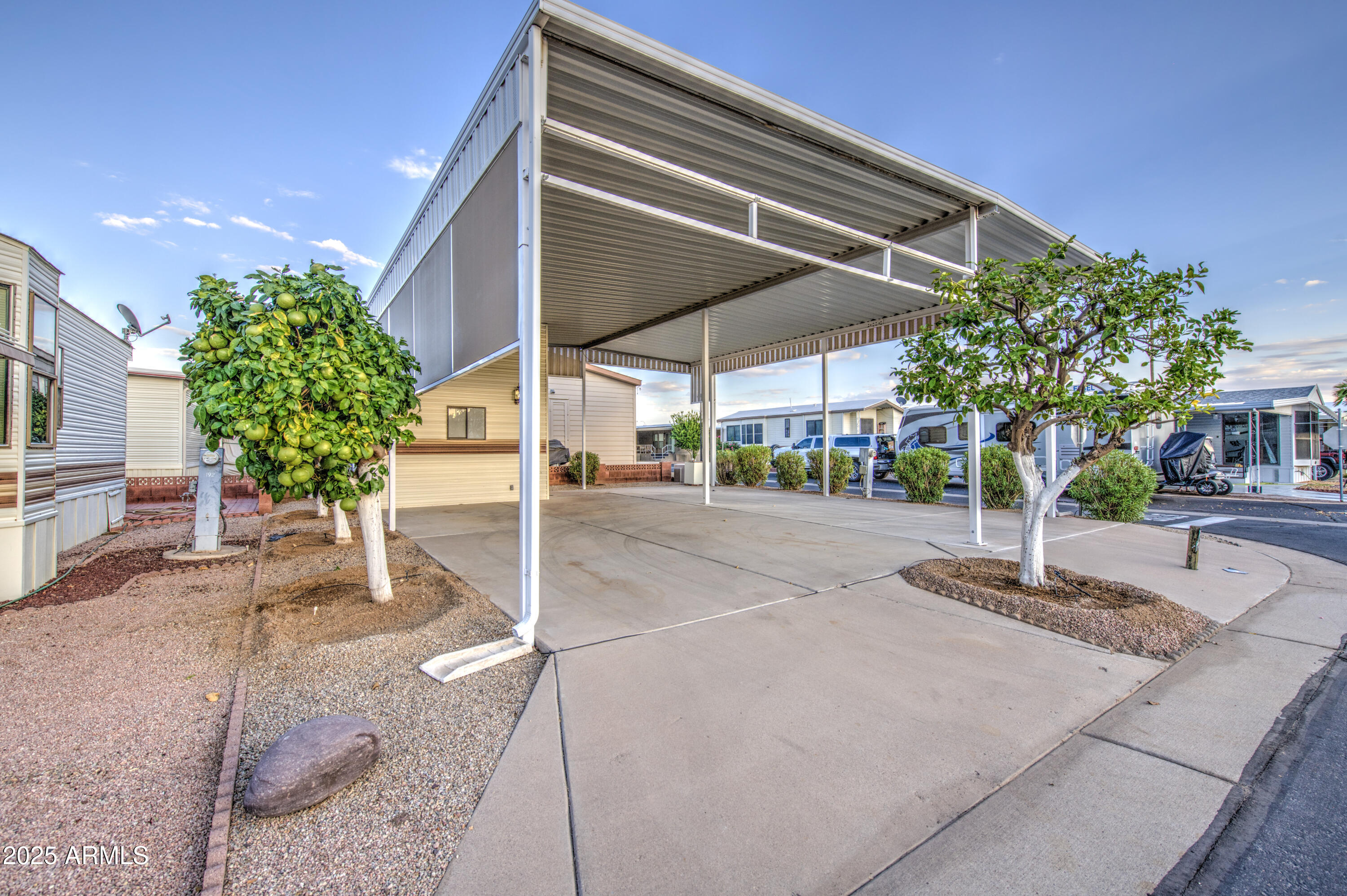 7750 East Broadway Road, Unit 191 Mesa, AZ 85208 - Photo 11 of 23 a building with trees in front of it