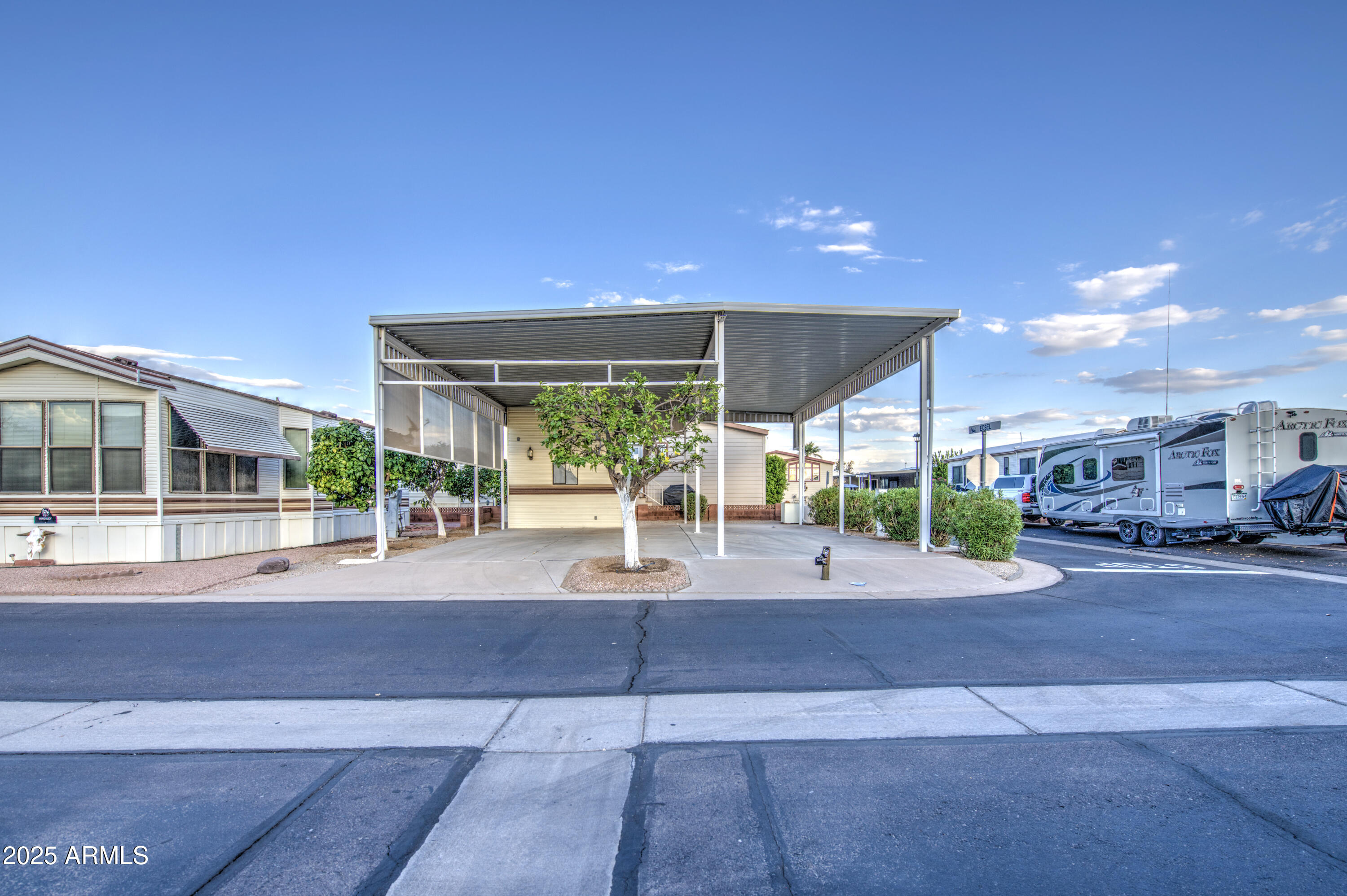 7750 East Broadway Road, Unit 191 Mesa, AZ 85208 - Photo 2 of 23 a view of a building with a street