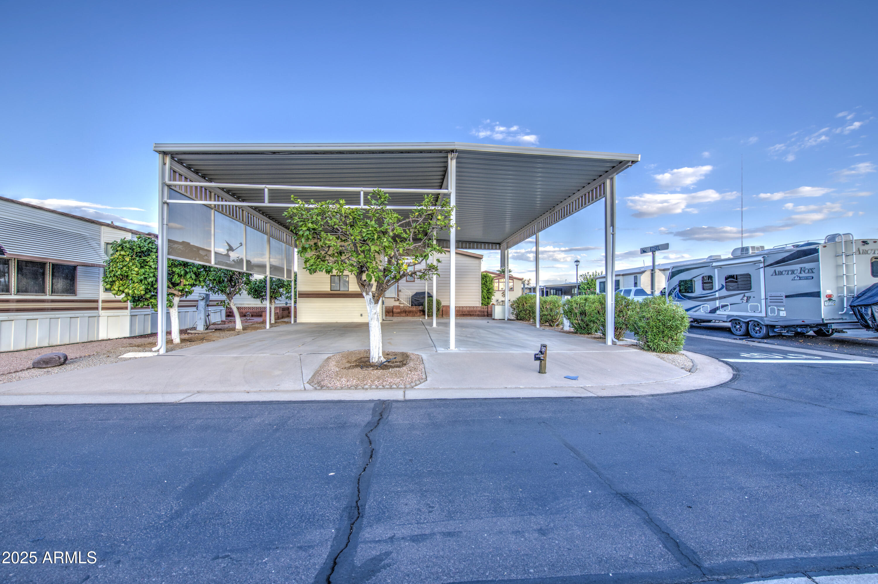 7750 East Broadway Road, Unit 191 Mesa, AZ 85208 - Photo 6 of 23 a building view with a outdoor space