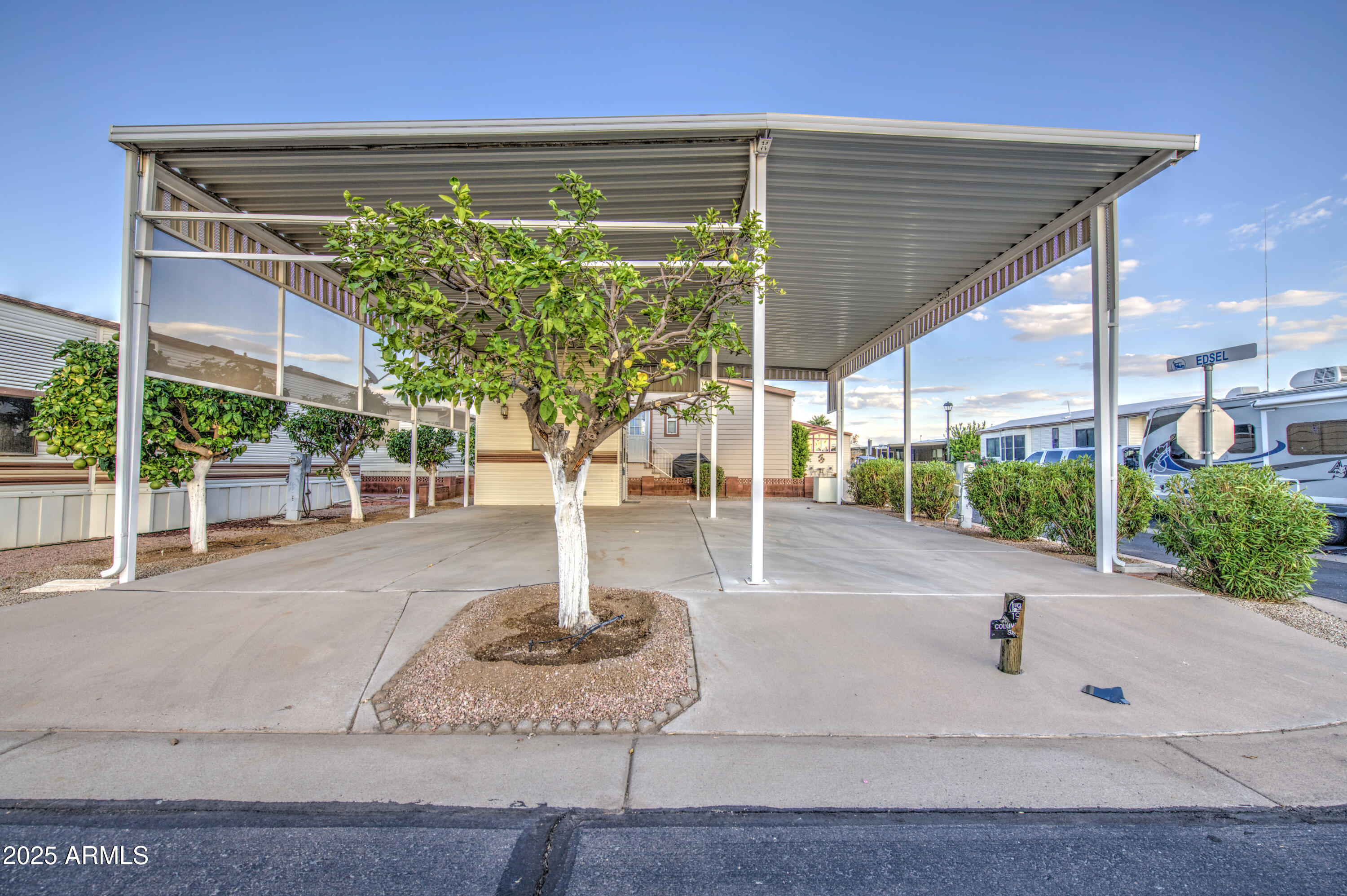 7750 East Broadway Road, Unit 191 Mesa, AZ 85208 - Photo 7 of 23 a swimming pool with outdoor seating