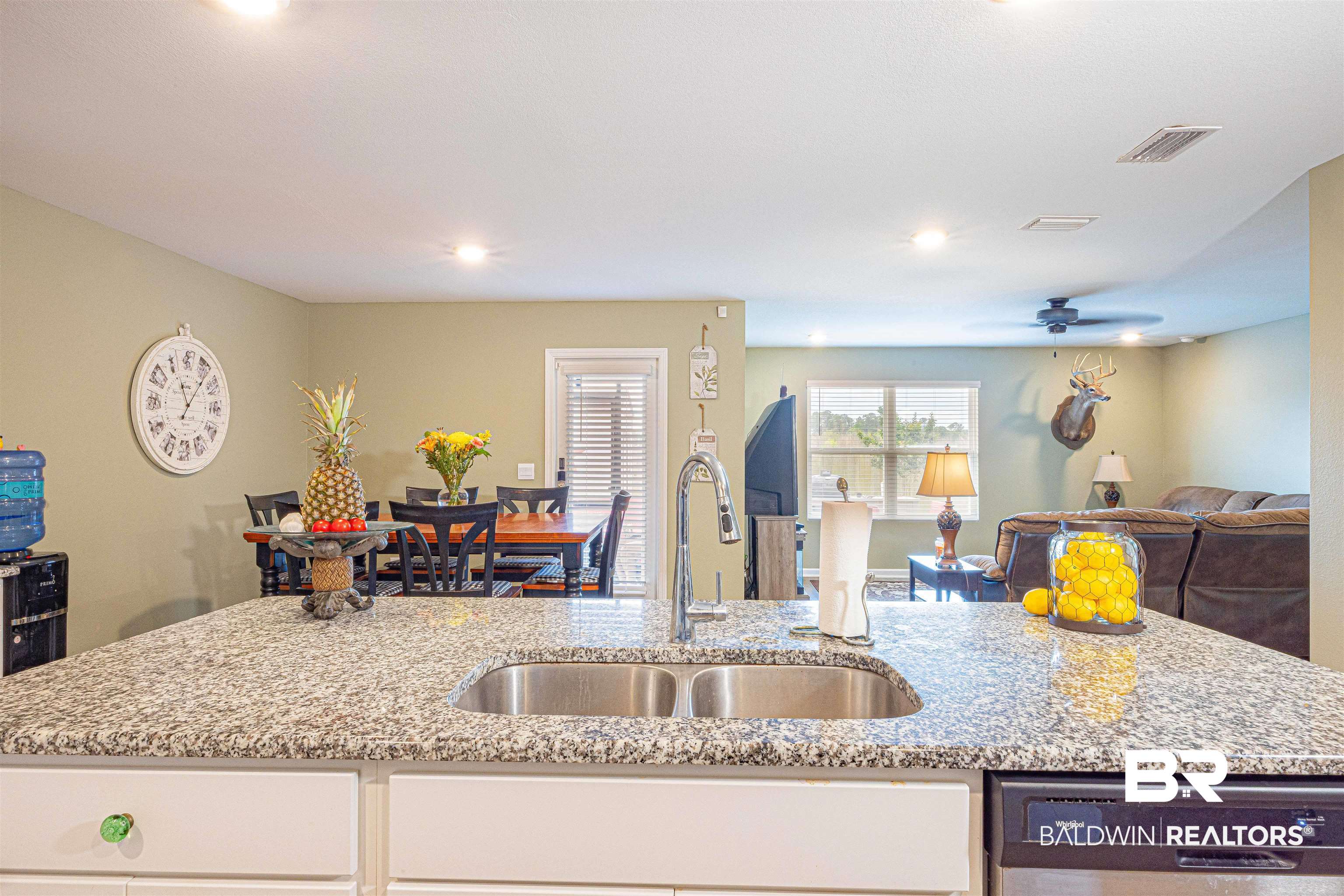 14843 Forsythia Loop Silverhill, AL 36576 - Photo 51 of 51 Kitchen with open floor plan, light stone countertops, dishwasher, and ceiling fan
