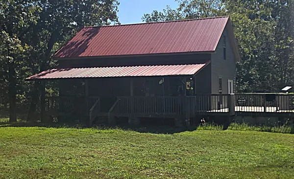 a backyard of a house with lots of green space