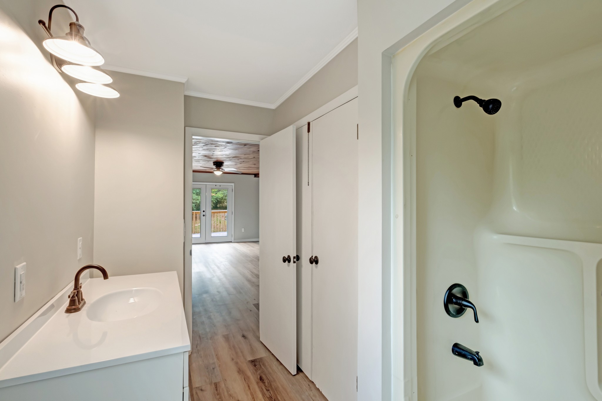 2312 Little Fish Trap Road Lawrenceburg, TN 38464 - Photo 30 of 48 a bathroom with a sink a mirror and shower