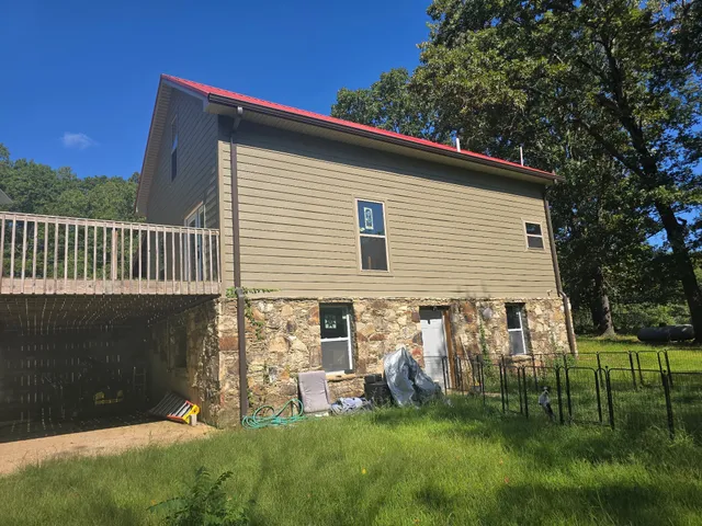 a kitchen with granite countertop a refrigerator oven a sink dishwasher and wooden floor