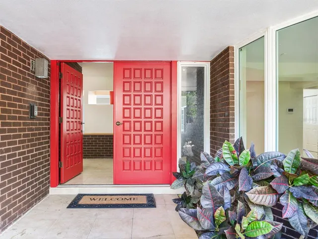 a kitchen with granite countertop cabinets stainless steel appliances and a counter space