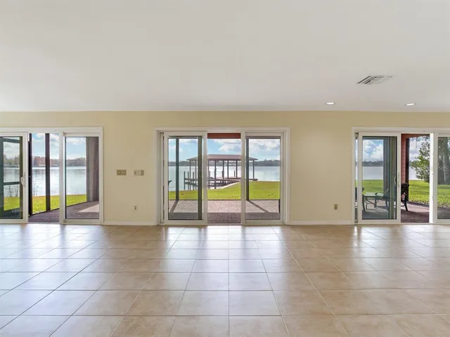 a view of a lake with houses in the back