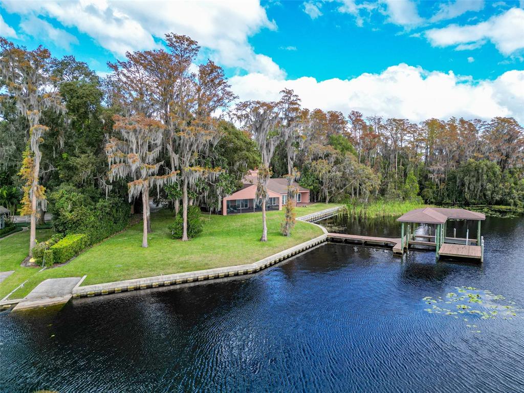 18120 Wayne Road Odessa, FL 33556 - Photo 6 of 100 a view of a house with a yard table and chairs