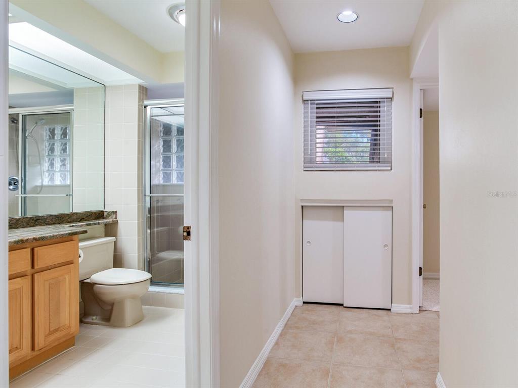 18120 Wayne Road Odessa, FL 33556 - Photo 65 of 100 a bathroom with a toilet sink and a mirror