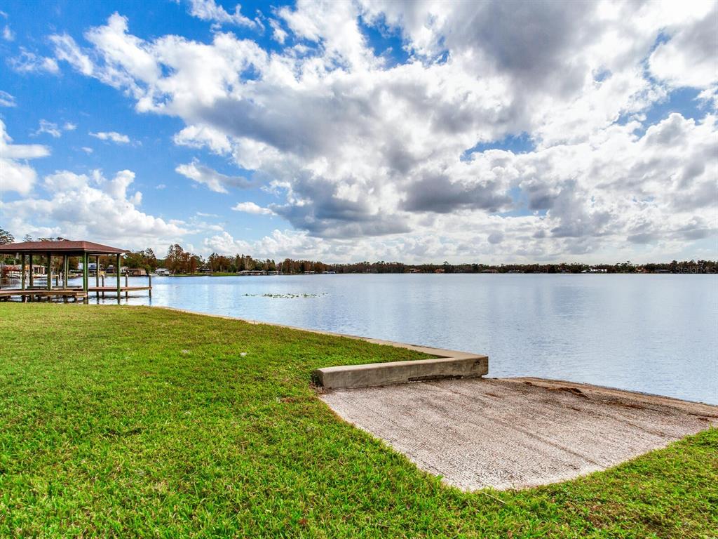 18120 Wayne Road Odessa, FL 33556 - Photo 80 of 100 a view of a lake with houses in the back