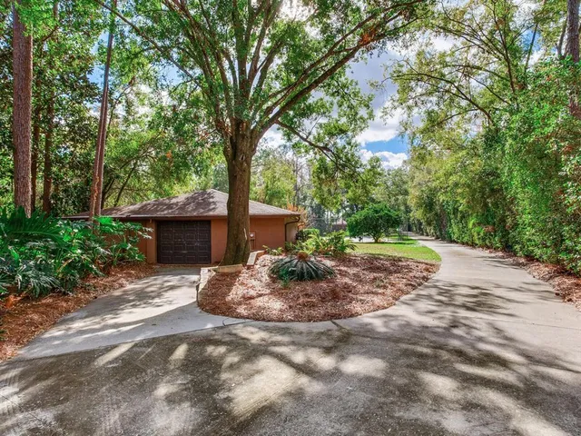 a room with pool table and windows