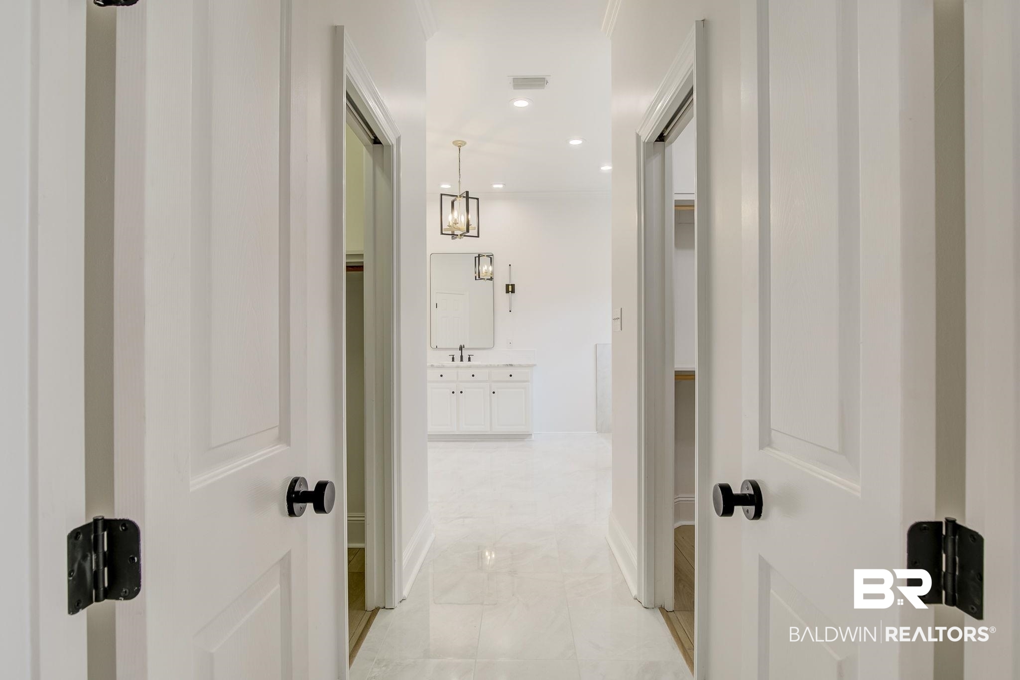 105 High Pines Ridge Fairhope, AL 36532 - Photo 49 of 97 Hallway featuring light marble finish flooring, baseboards, and recessed lighting