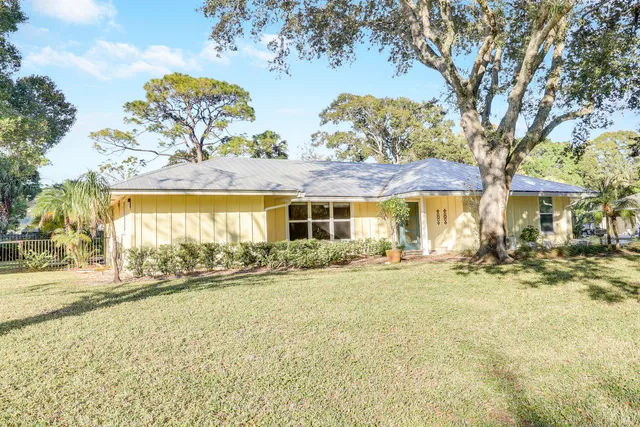 swimming pool with outdoor seating and yard