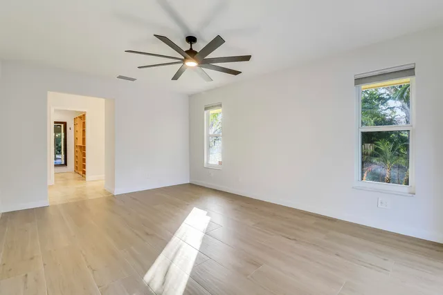 a view of a bathroom with a sink and a mirror