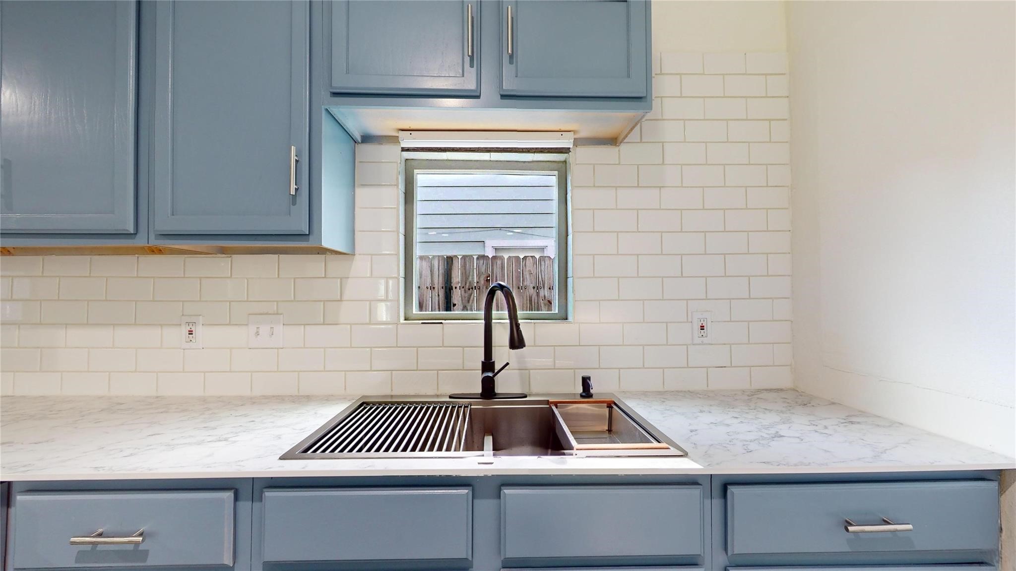 3806 Cosby Street Houston, TX 77021 - Photo 16 of 48 a kitchen with a sink and cabinets