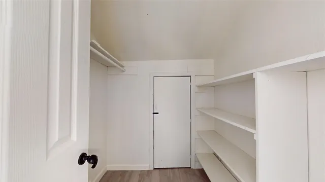 a view of an empty walk in closet