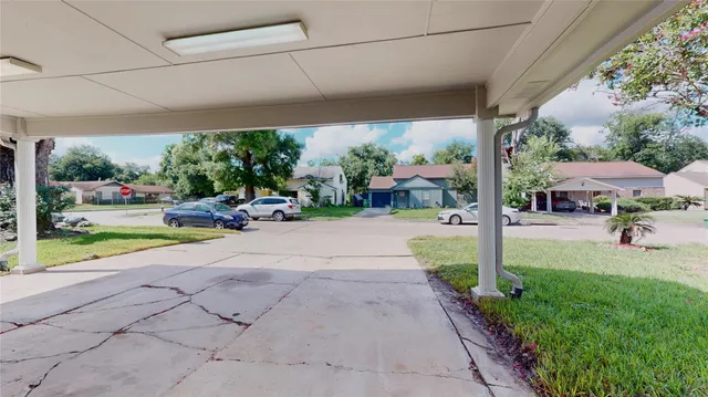 a view of a park with potted plants