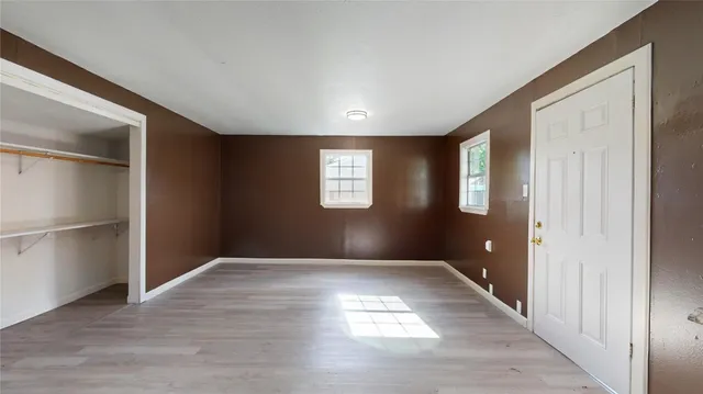 a view of an empty room and window