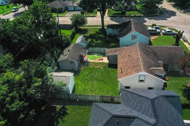 an aerial view of a house with a garden