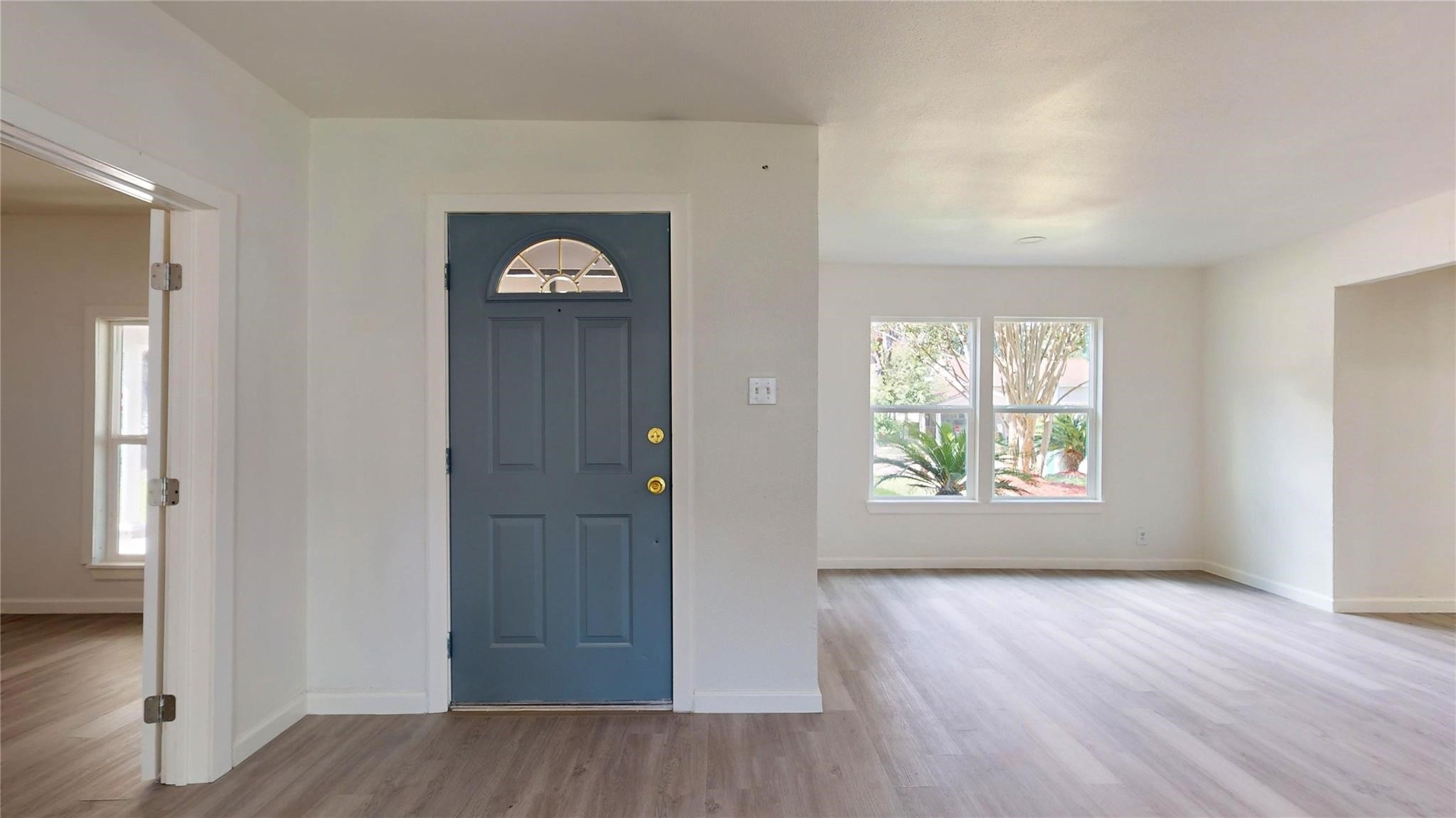 3806 Cosby Street Houston, TX 77021 - Photo 6 of 48 an empty room with wooden floor closet and windows