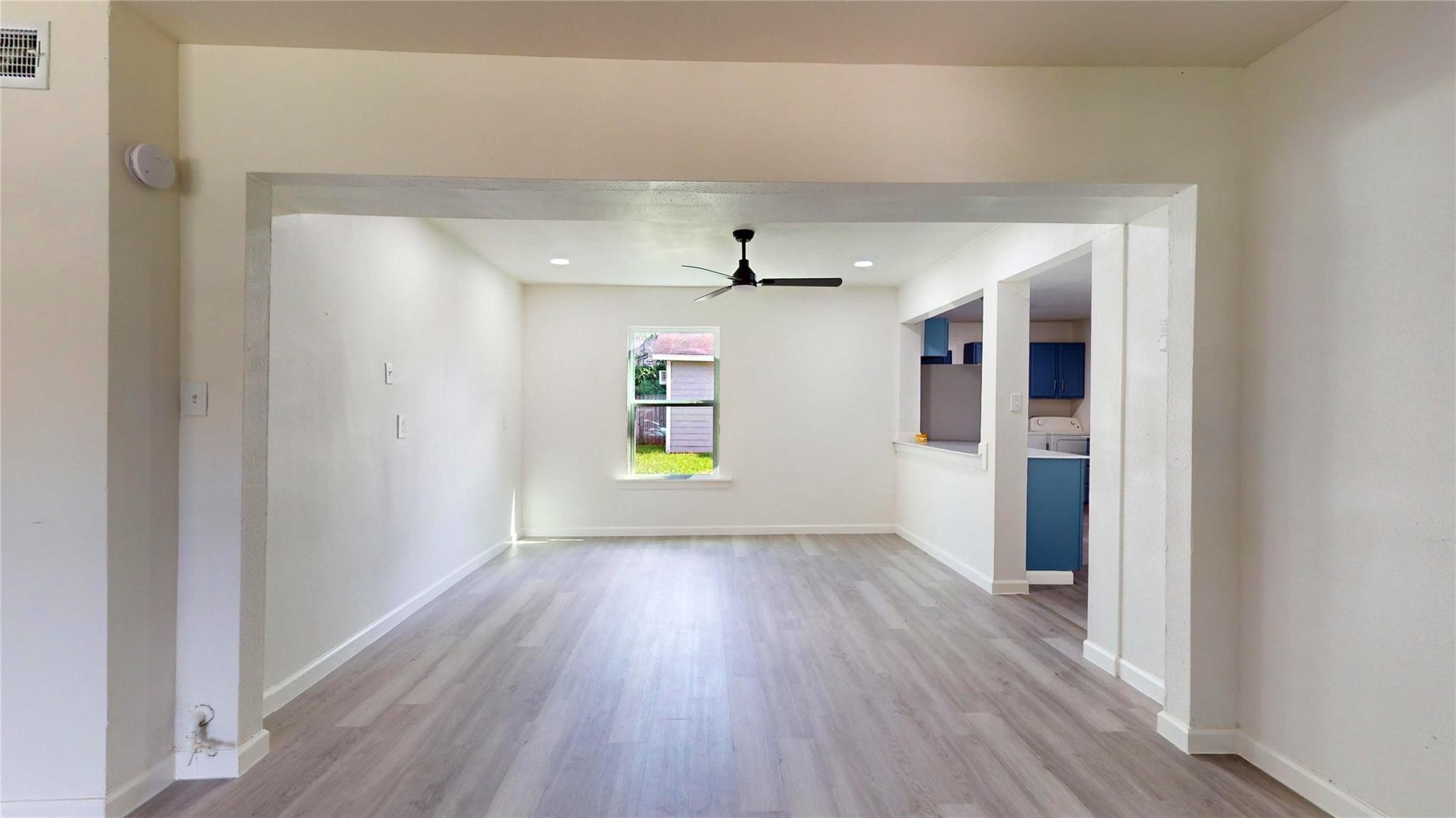 3806 Cosby Street Houston, TX 77021 - Photo 7 of 48 an empty room with wooden floor and windows