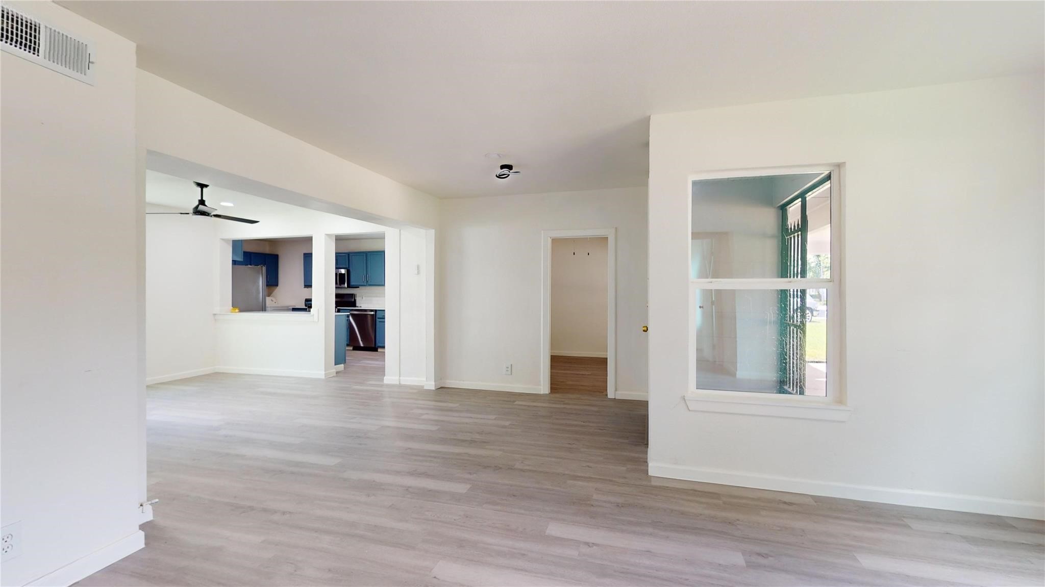 3806 Cosby Street Houston, TX 77021 - Photo 10 of 48 a view of a big room with wooden floor and windows