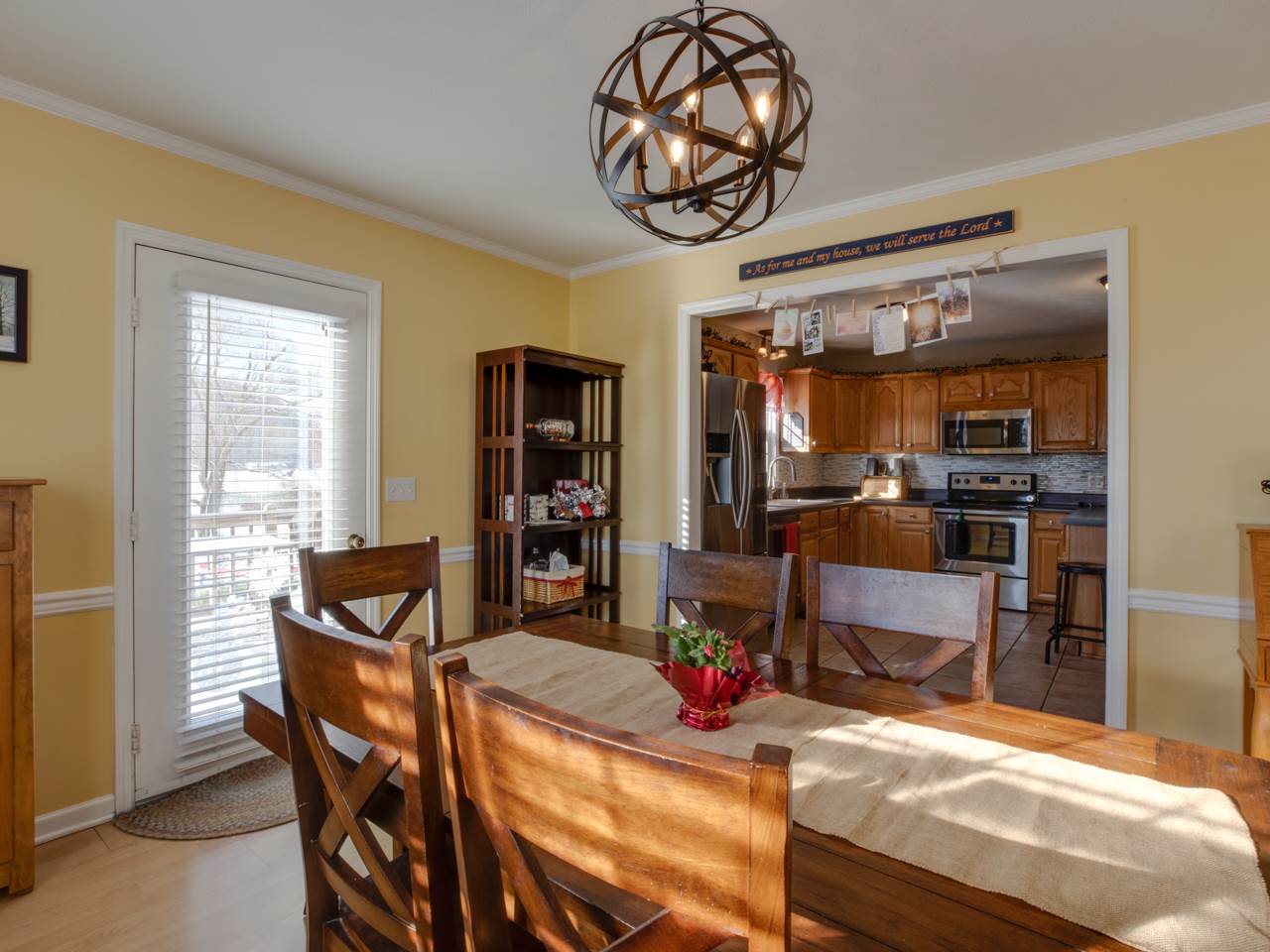402 Dry River Road Bridgewater, VA 22812 - Photo 10 of 35 The dining room of the home contains hardwood flooring throughout, crown molding, and offers beautiful views of the backyard through multiple large windows.