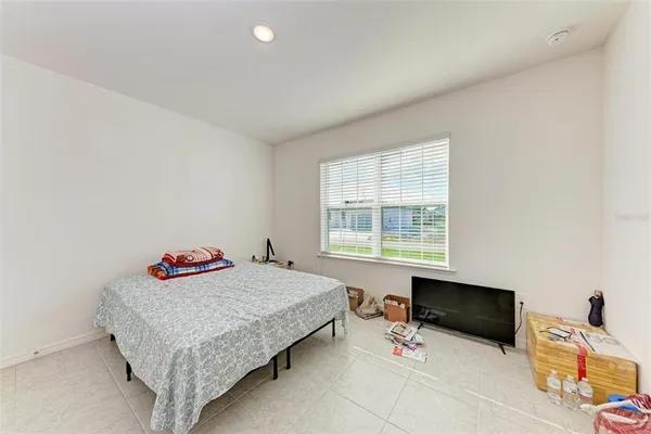 a bedroom with a bed and a table