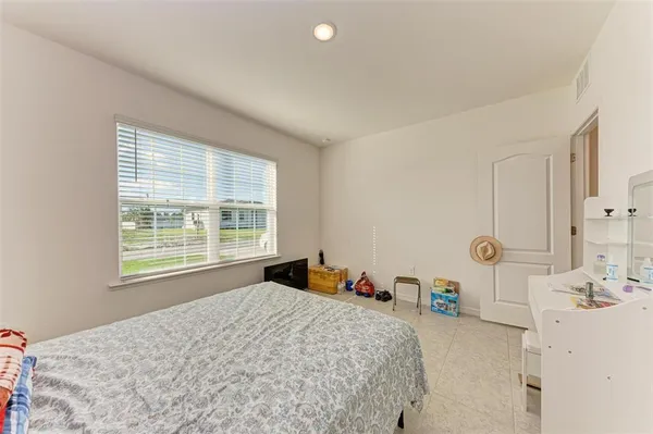 a view of walk in closet with clothes