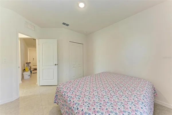 a room with a bed and a window