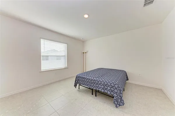 a bedroom with a bed and a cabinets