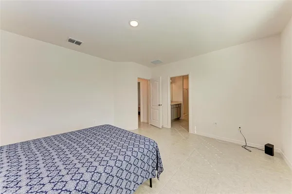 a living room with a rug and a table