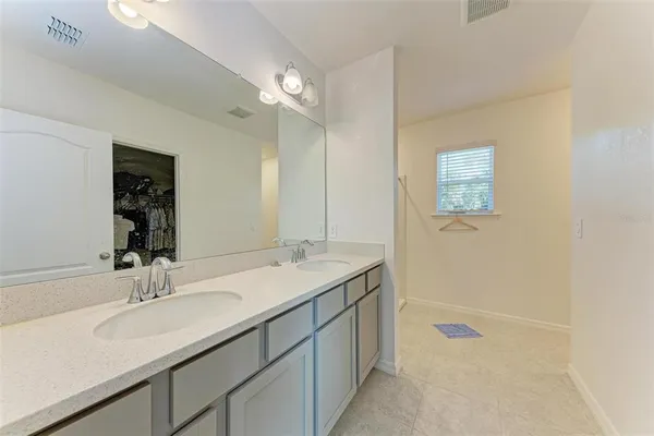 a bathroom with a shower and a window